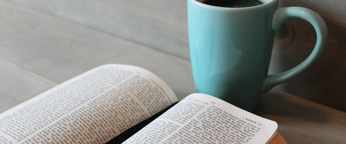 Turquoise mug and open book